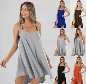 Detail view of a sleeveless swing dress with spaghetti straps and high-low hem in five colors