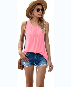 Detailed view of pink sleeveless top with pleated neckline and casual summer resort style