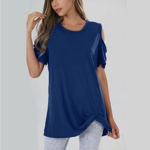 Detail of navy blue cold-shoulder t-shirt showing soft fabric and front knot design