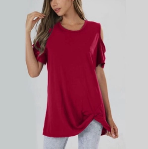 Detail of burgundy off-shoulder T-shirt with twisted knot hem and soft knit texture