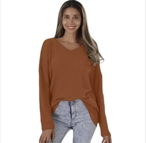Detail of caramel V-neck long sleeve top in waffle knit fabric with a loose casual fit