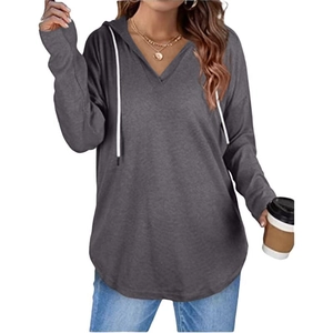 Detail of dark grey V-neck hoodie showing soft knit fabric and white drawstrings