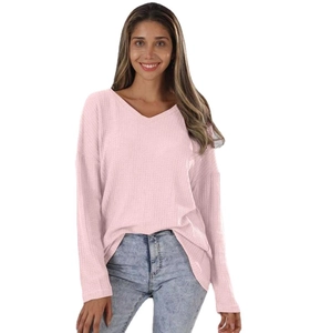 Women's pink waffle knit V-neck sweater with drop shoulders and long sleeves in a loose fit