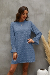 Detail of blue Swiss dot long sleeve dress with elastic ruffled cuffs and textured fabric