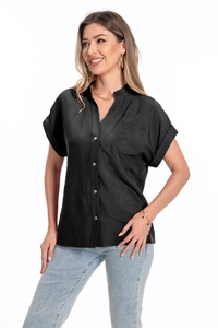 Detailed close-up of a black cotton linen shirt featuring V-neckline and buttoned pocket