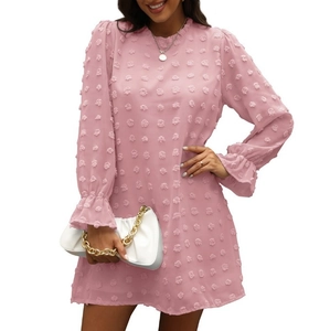 Pink long sleeve Swiss dot dress with ruffled cuffs and subtle A-line silhouette