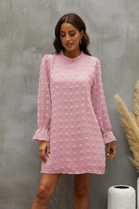 Detail of pink long sleeve dress with textured swiss dots and ruffled high neck collar