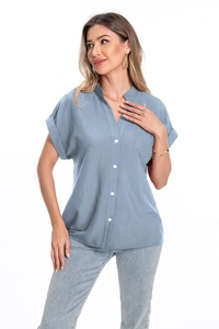 Close-up of a blue short-sleeve linen shirt featuring a V-neck and front pocket detail