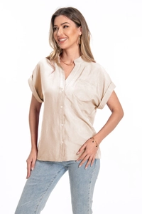 Detail of short sleeve champagne satin shirt with V-neck collar and single chest pocket
