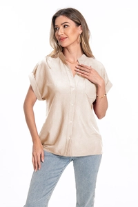 Detailed view of beige linen-blend shirt featuring vertical texture and button-up front