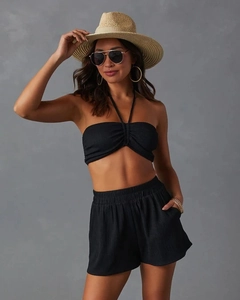Detail of black woven summer set with halter top and elastic waist shorts