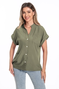 Detailed macro of olive green cotton linen shirt texture with white buttons and pocket
