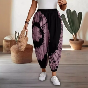 Women's boho tie-dye harem pants with high elastic waist and cinched ankles for casual wear