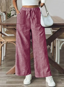 Close-up of women's burgundy striped wide-leg pants with elastic drawstring waist and pockets