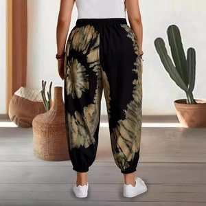 Back view of women's loose tie-dye joggers with high elastic waist and cuffed ankles
