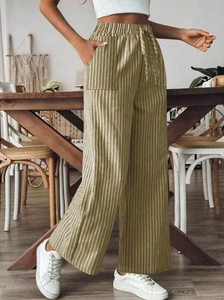 Close-up of olive green striped wide-leg pants with elastic waist and large pockets