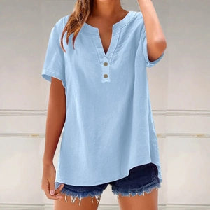Close-up of light blue summer V-neck linen top with decorative wooden buttons