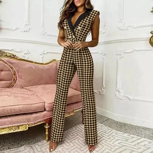 Houndstooth V-neck sleeveless jumpsuit with contrast lapel and golden buttons