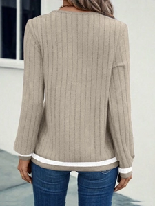 Detailed back view of camel ribbed long-sleeve top with white striped hem and cuff stitching