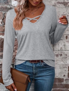 Women's V-neck dark grey long sleeve top with ribbed texture and crisscross neckline detail