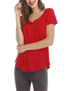 Detail of red Henley neck top featuring three buttons and pleated chest detailing
