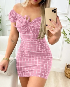 Detail of pink plaid off-shoulder mini dress with puff sleeves and front bow tie