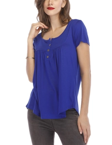 Detail of dark blue women's tee featuring decorative buttons and elegant pleated front