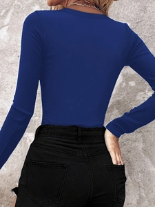 Back view of a slim-fit navy blue ribbed knit long sleeve top with textured fabric details