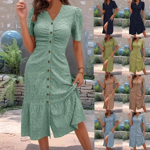 Detail of V-neck summer midi dress with eyelet embroidery and button front closure