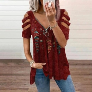 Detail of dark red V-neck top with zipper and bohemian feather print on the fabric