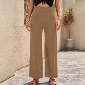 Brown wide-leg rib-knit trousers featuring high waist design and breathable stretch fabric