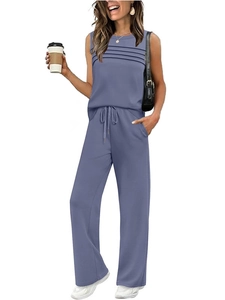 Close-up of pleated mauve sleeveless top and high-waisted drawstring trousers set