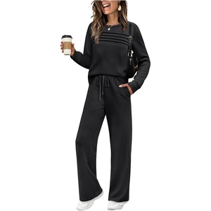 Women's black long sleeve loungewear set with pleated sweatshirt and wide leg pants