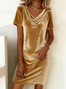 Detail of the cowl neck design and soft velvet texture on this mustard yellow dress