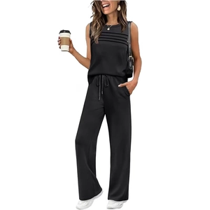 Women's black casual two-piece set with sleeveless pleated top and wide-leg drawstring pants