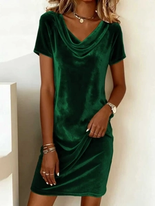 Detail view of the draped neckline on a dark green velvet dress for women