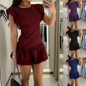 Detail of ruffle hem sleeveless dress in burgundy, purple, black, and navy colors