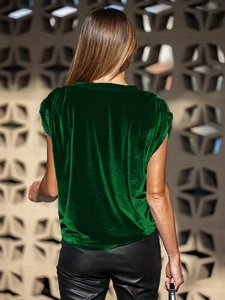 Détail du haut en velours vert foncé avec texture brillante et vue de dos