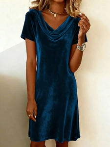 Detail of elegant cowl neck design on dark blue velvet short sleeve midi dress