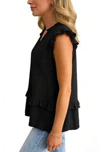Detail of black V-neck tank top featuring layered ruffle hem and textured fabric