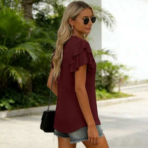 Detail view of double-layered ruffle sleeves on this wine red V-neck summer blouse