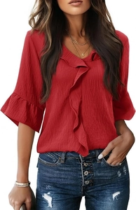 Detailed macro view of the red V-neck blouse with ruffled edges and pleated texture fabric