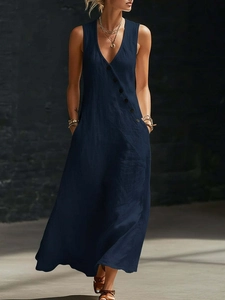 Detail view of navy blue V-neck linen maxi dress featuring stylish diagonal front buttons