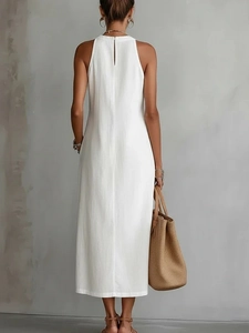 Back view of a white sleeveless halter maxi dress featuring a small keyhole button closure
