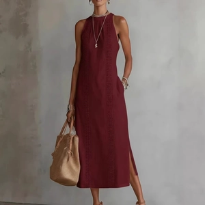 Detail view of burgundy halter maxi dress with crochet embroidery and side slit design