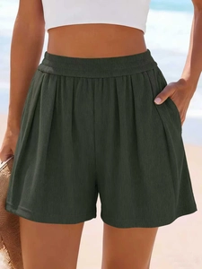 Détail du tissu côtelé vert foncé pour short de sport ample avec taille élastique