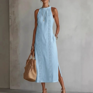 Detail showing embroidered lace panels and side slit on a light blue halter dress