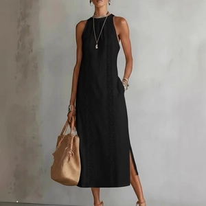 Detail of a black sleeveless maxi dress featuring halter neck and geometric embroidery