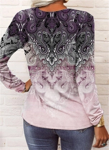 Detail of bohemian paisley floral print and gradient transition on long sleeve shirt