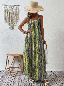 Detail of bohemian floral maxi dress with green and purple abstract patterns and spaghetti straps
